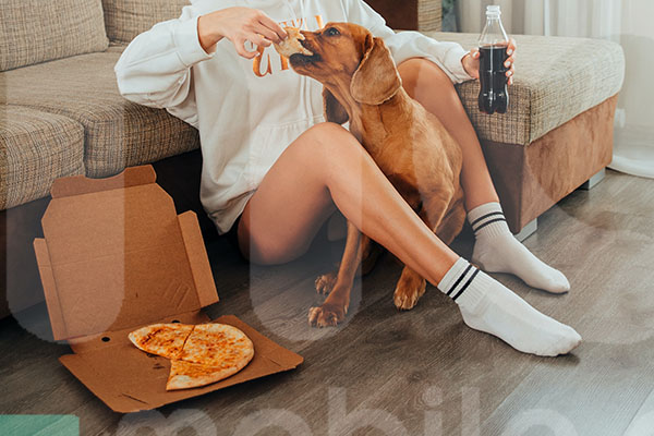 Snapshot of a woman enjoying a pizza
